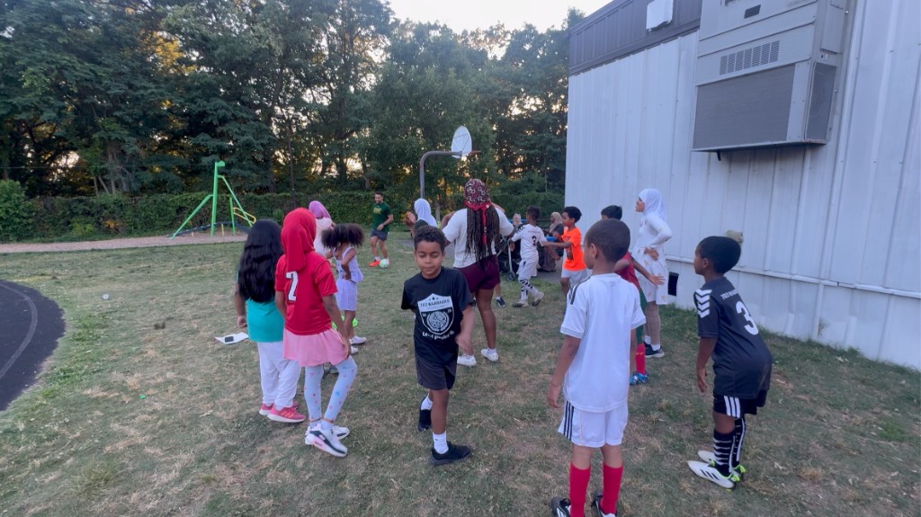 Young athletes lined up during an SOS practice