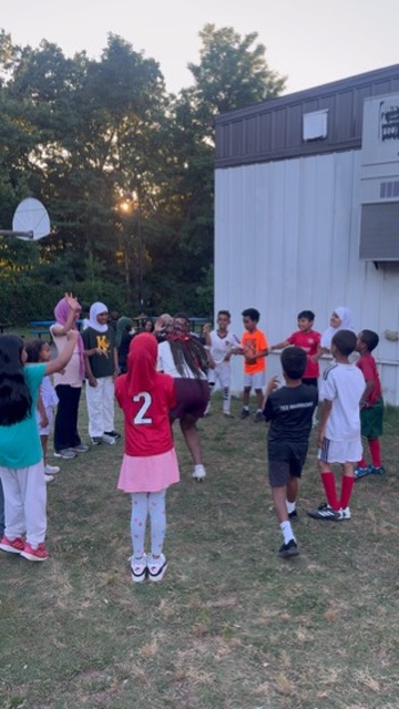 Youth players in team jerseys at practice
