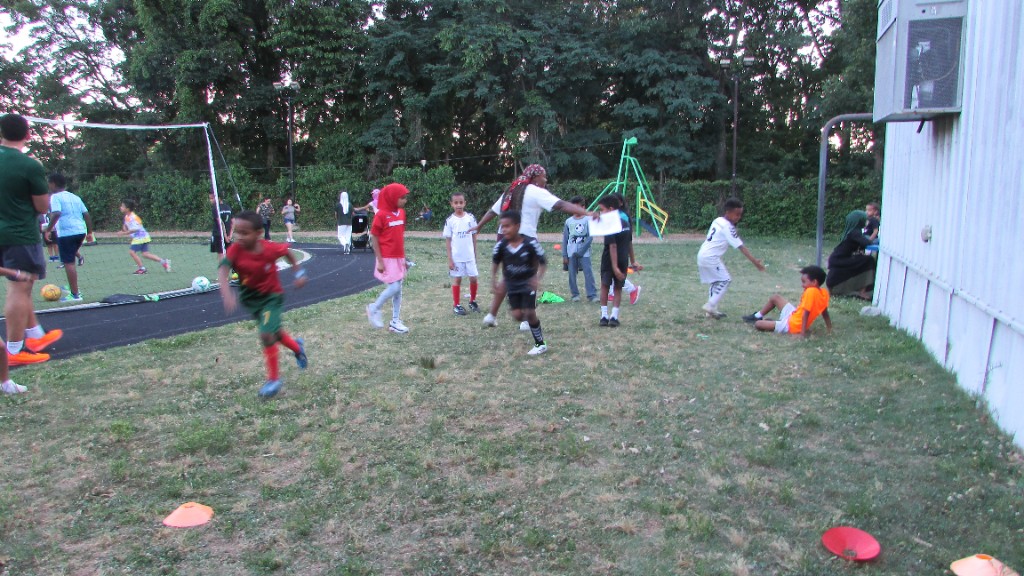 Youth athletes practicing on the turf field