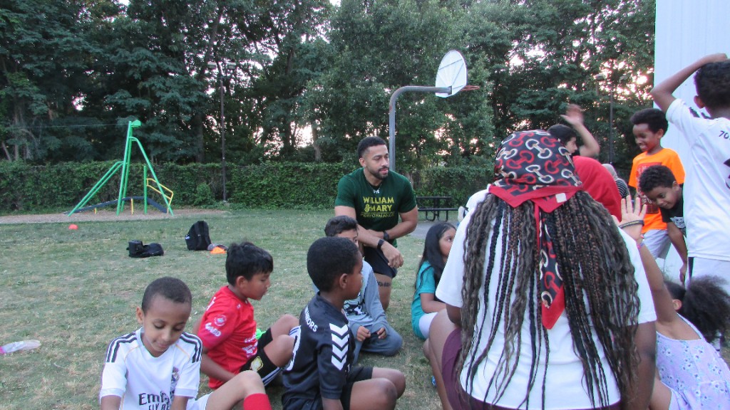 Coaches addressing youth during SOS program