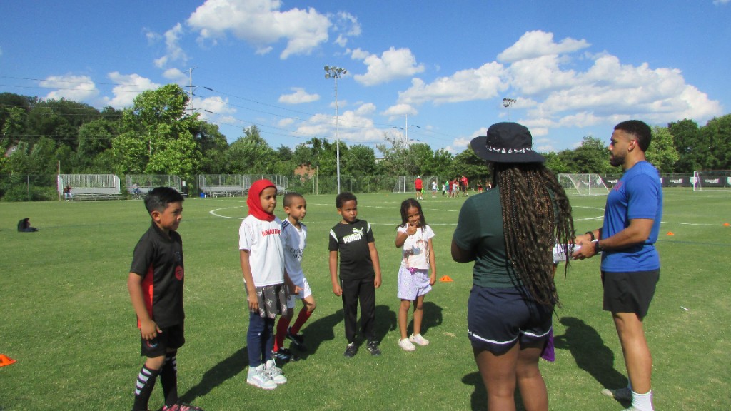 Coaching moment with young players on the soccer field