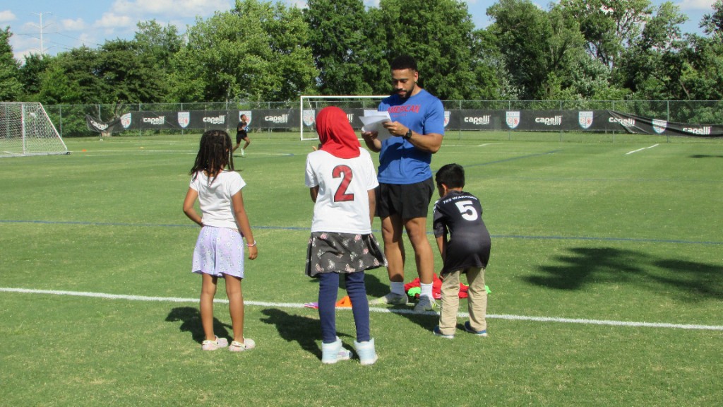 Youth soccer practice with mentors