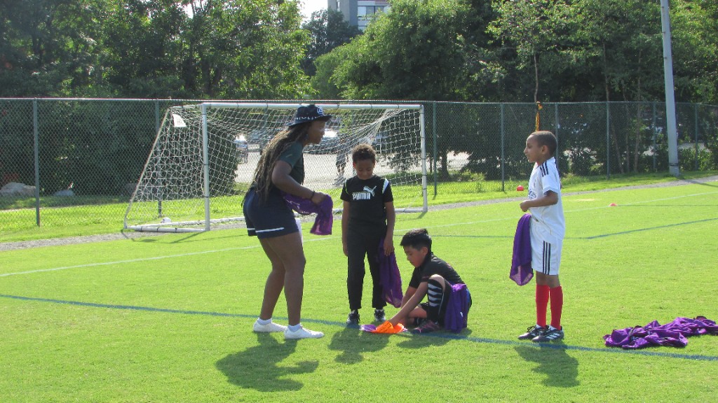 Youth athletes practicing on the field